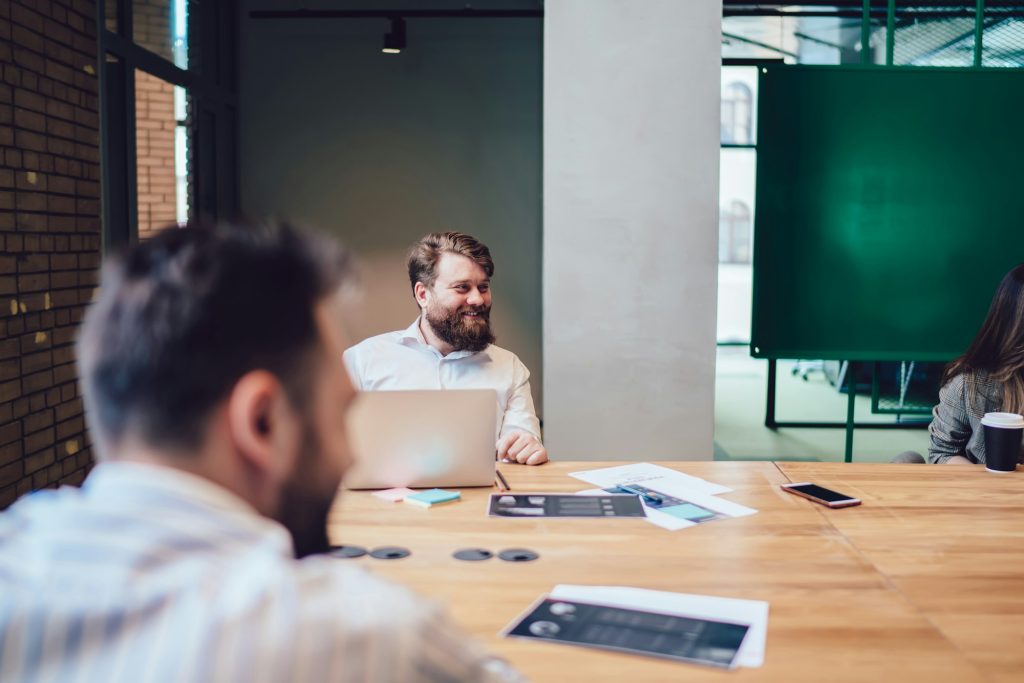 Cheerful entrepreneur attending business meeting